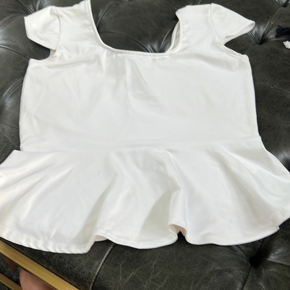 White peplum Bebe top. Size large, stretchy fabric